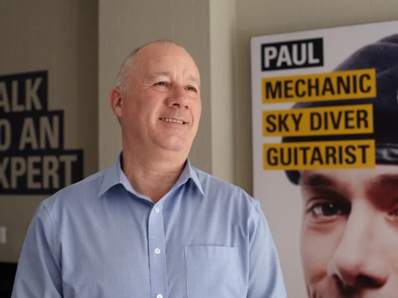 person standing near career poster display
