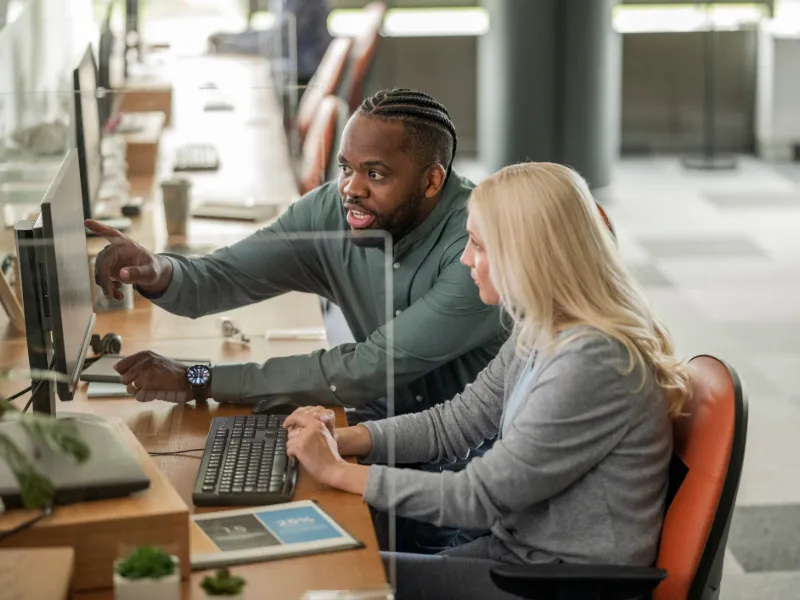 office team collaborating on desktop workstation 2208469735 800x600