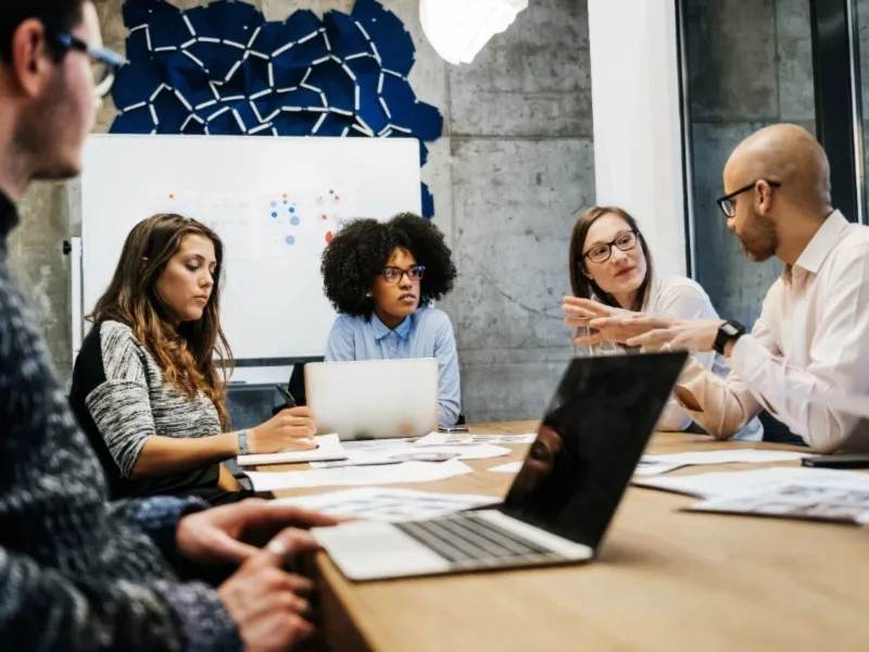 Planning officers using modern digital tools and analytics dashboards