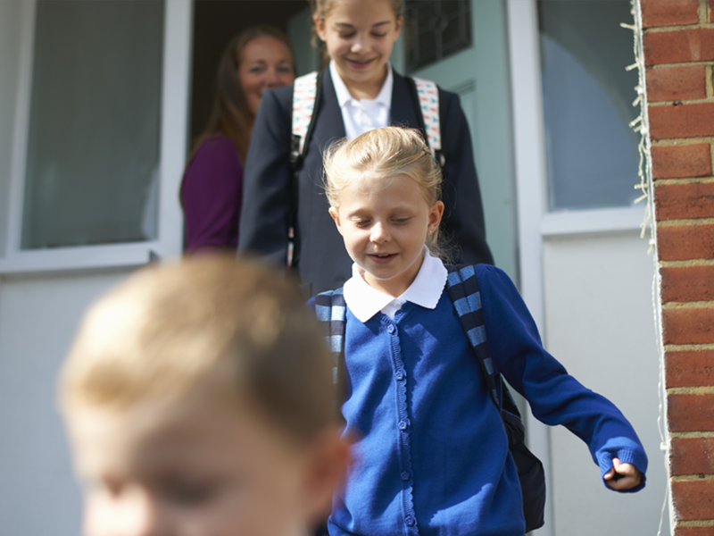 School children leaving the house