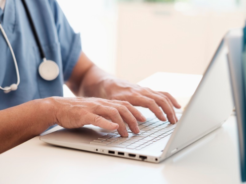 Doctor using laptop