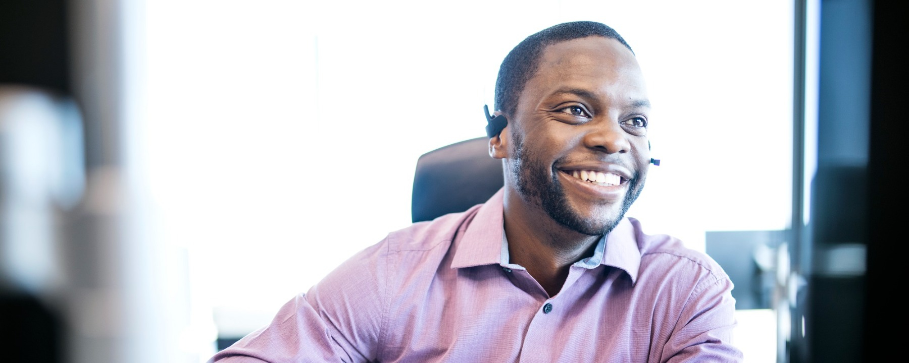 Procurement Man talking on head set