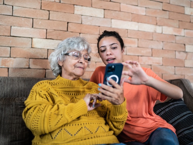 Granddaughter helping grandmother