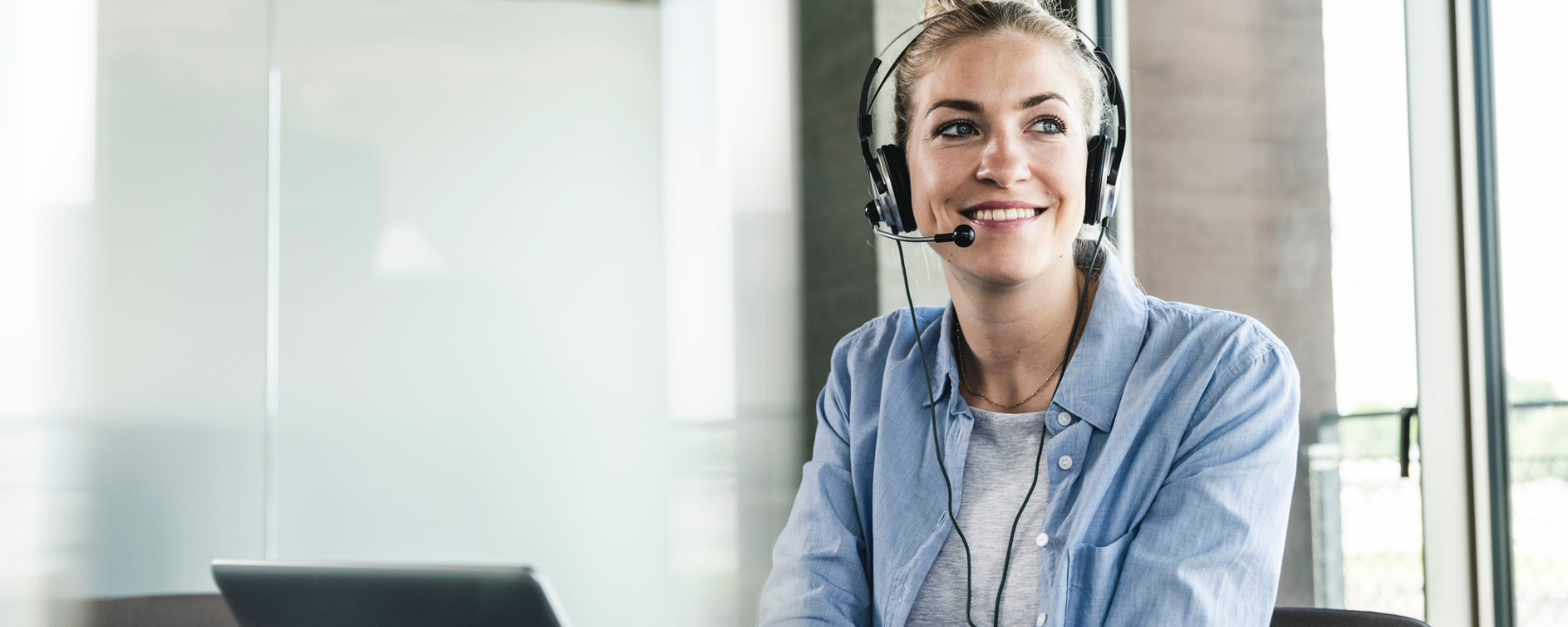 Young businesswoman sitting at desk