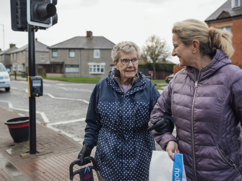 A mature woman out and about with her mother