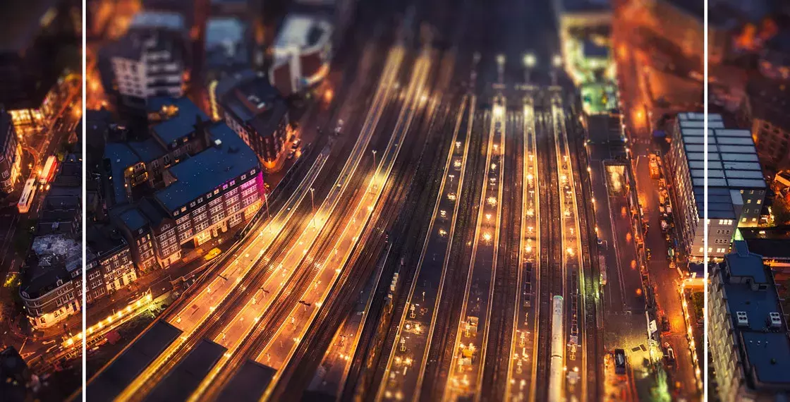 Birds eye view of train tracks lit up