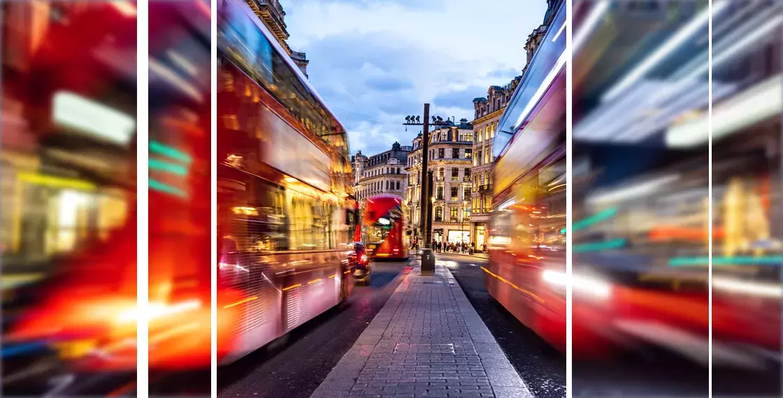 Busy London street with moving buses