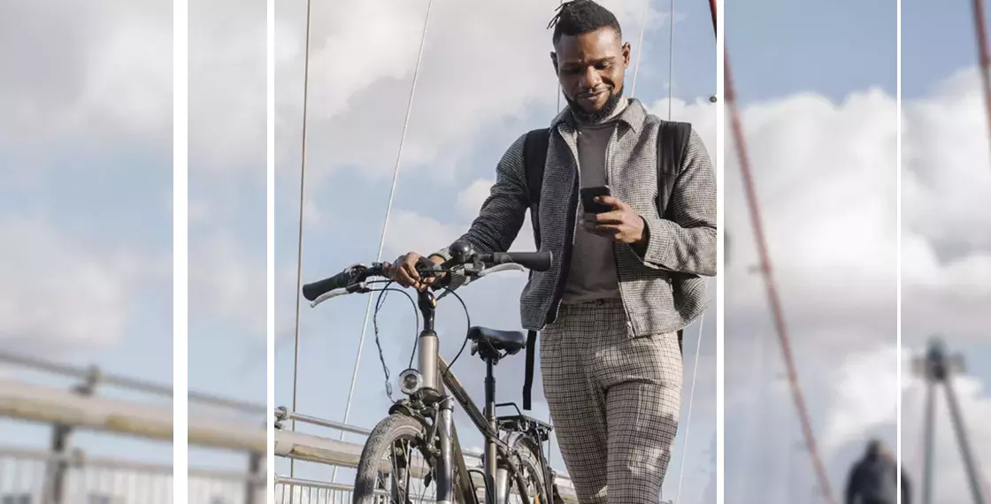 man on bike using mobile phone