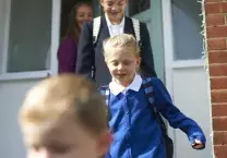 School children leaving the house