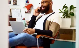 Businessman using phone in home office