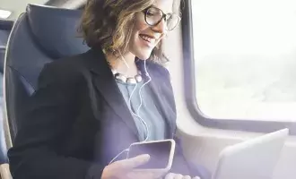 Woman on train using tech