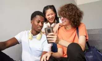Teenagers looking at phone