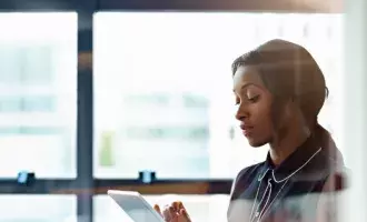 businesswoman-using-a-digital-tablet-in-office