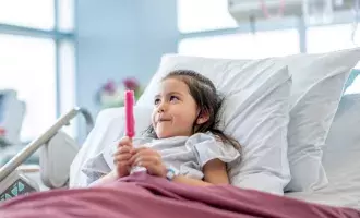 Healthcare-Little Girl Eating a Popsicle After Surgery