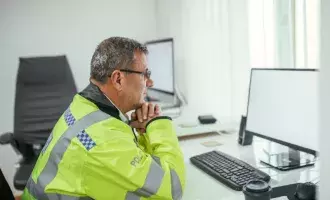 Police officer siiting at office