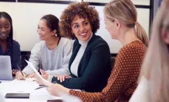 Group-Of-Businesswomen-Collaborating-In-Creative-Meeting