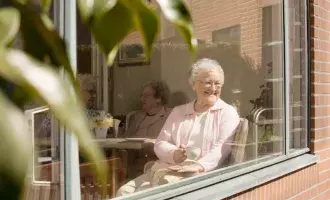 Elderly Women Sitting in Nursing Home Window