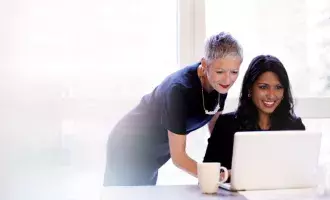 Mature business woman mentoring a younger woman