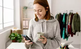Female owner using cell phone- 1367872334-Embed