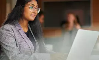 woman working at laptop GettyImages-1443301261-Embed