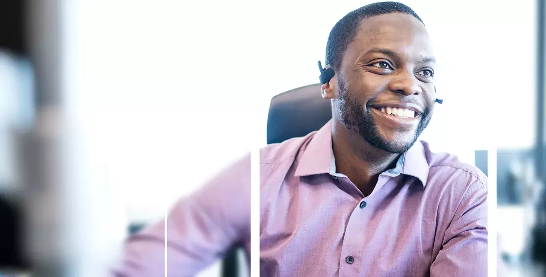 Man smiling wearing a head set