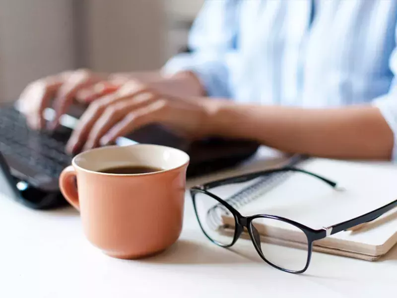Regulatory news and alerts | Capita Remote worker typing on laptop