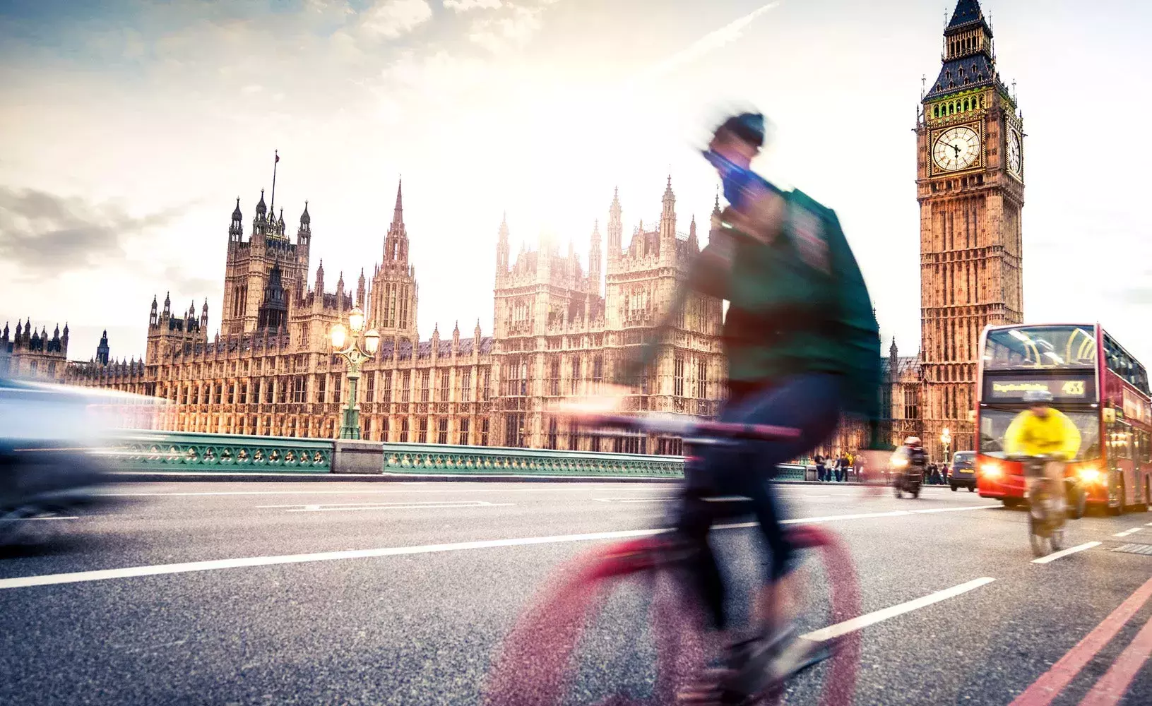 Capita climate change hub Cyclist passing Big Ben in London