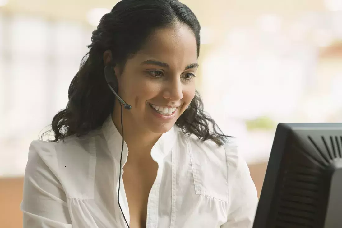 Capita Customer Services roles Customer service rep with headset, smiling