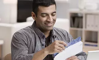 Share fraud and unsolicited mail | Capita Man opening mail