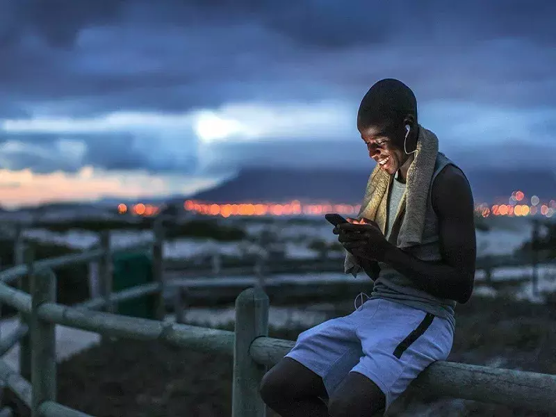 Digital Connectivity Young teenager looking at phone