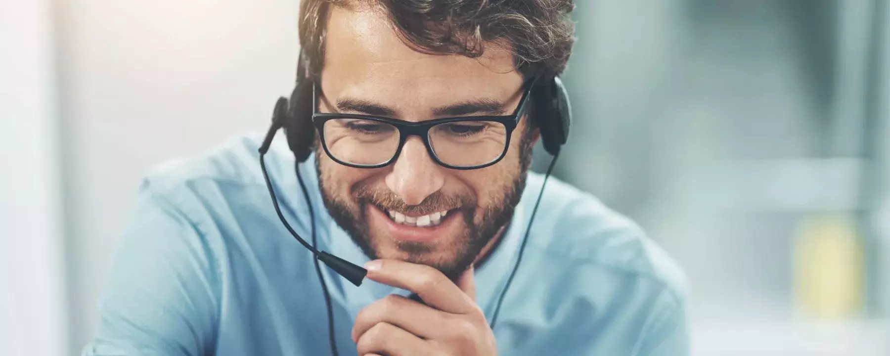 Contact us - happy-young-man-working-in-a-call-center