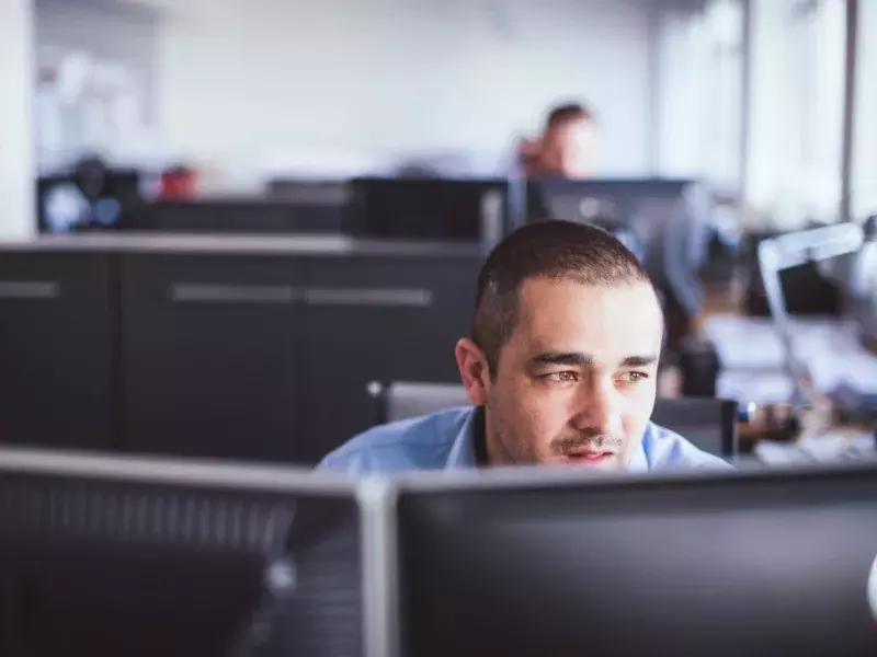 IT employee looking at computer