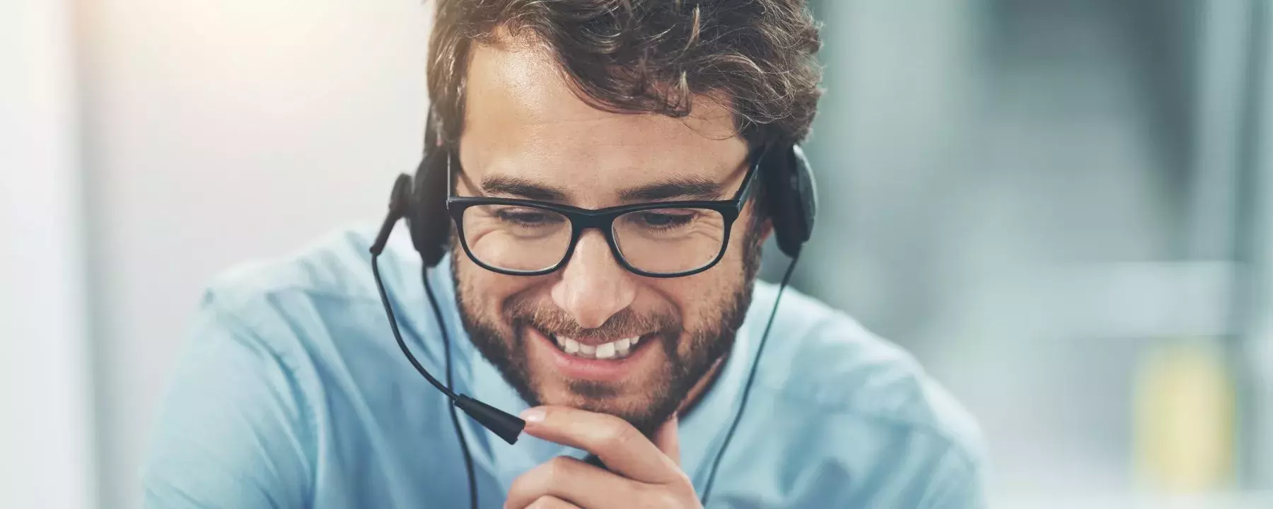 happy-young-man-working-in-a-call-center
