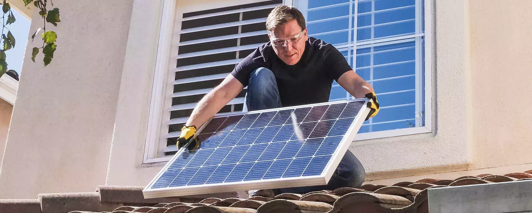 Utilities-Man installing solar panels