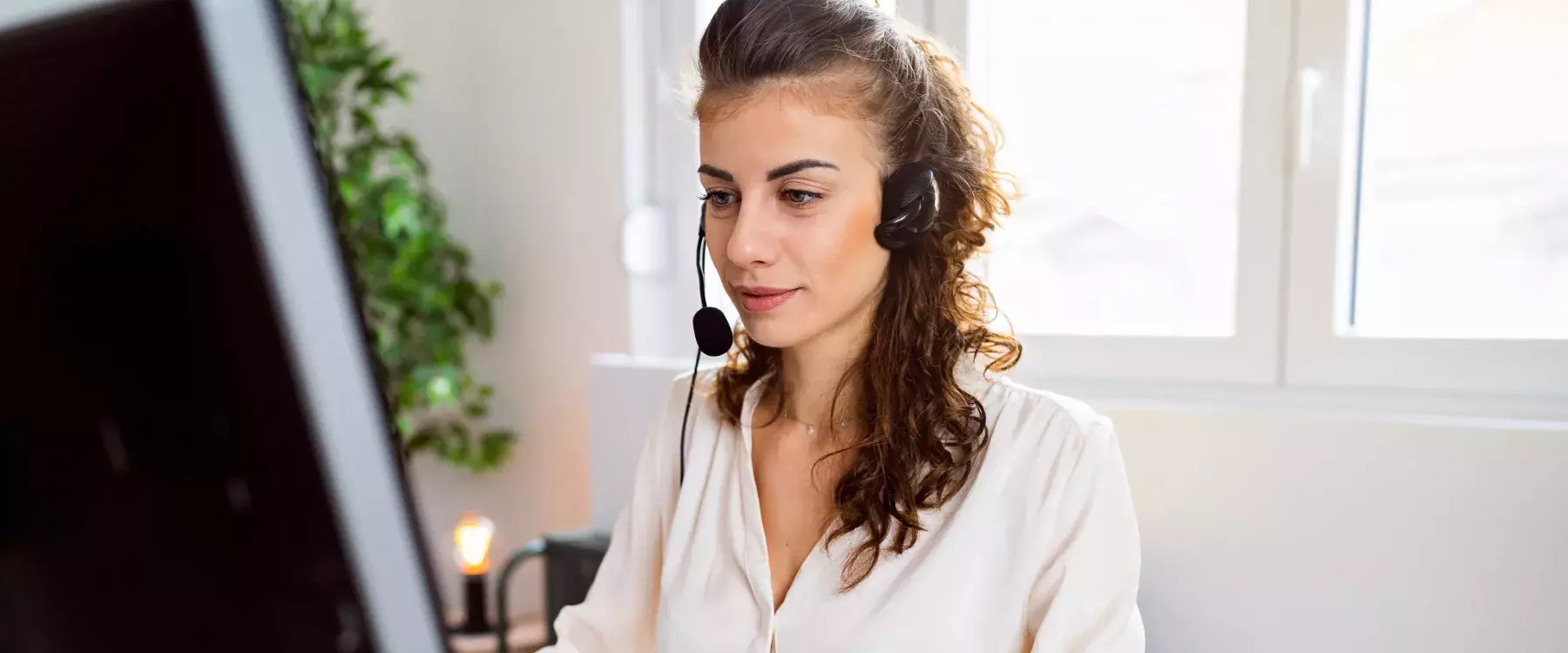 Customer support specialist working at her office