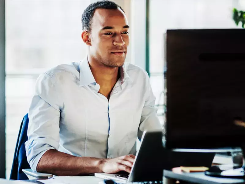 Actuarial services Person working on a computer in an office